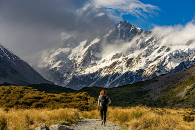 A walker on a mountain trail
